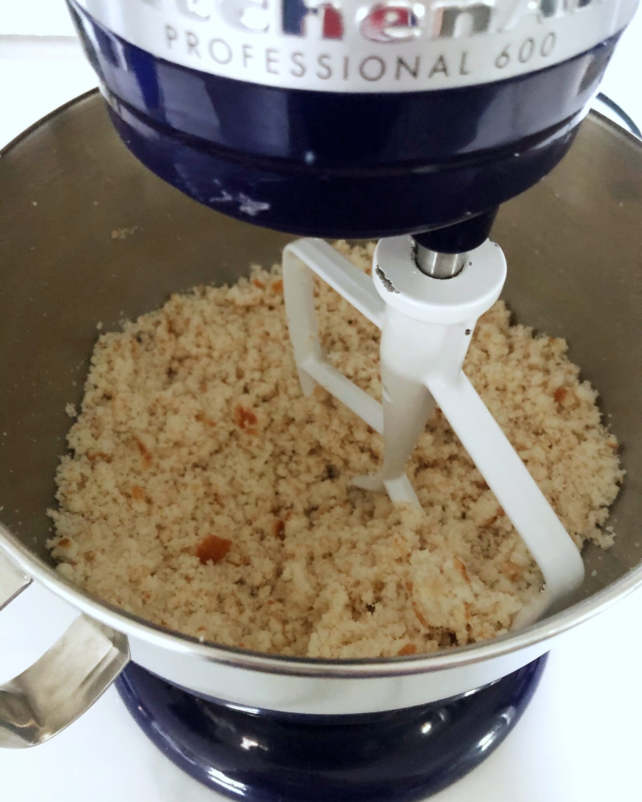 crumbed cake in bowl of stand mixer