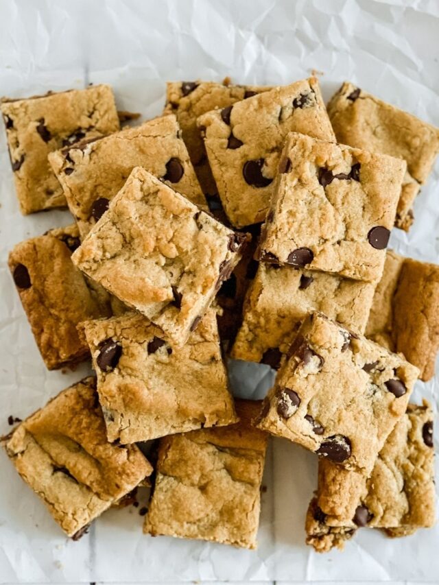 pumpkin chocolate chip cookie bars stacked in a pile