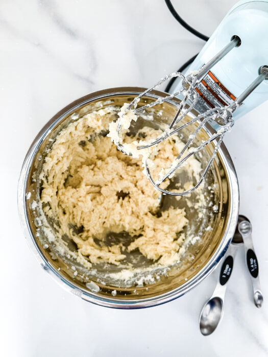 Process Shot - Butter, Sugar, and Eggs Combined in Mixing Bowl