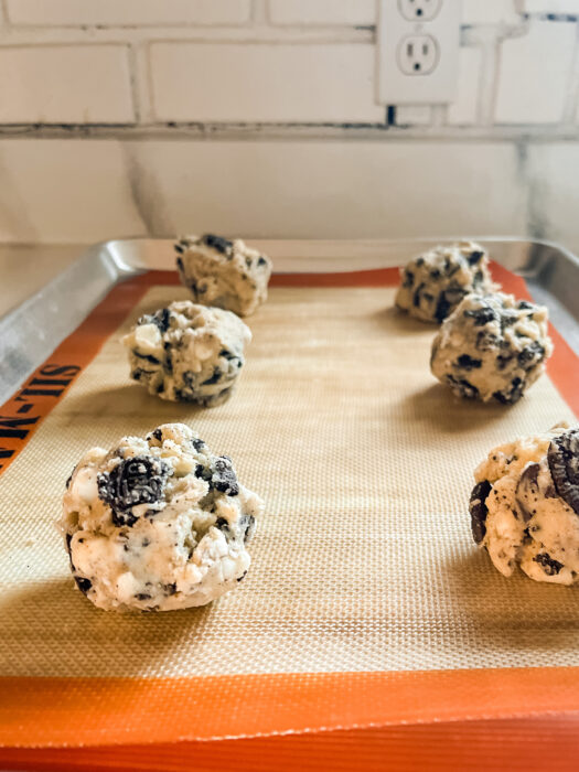 cookie dough balls on baking sheet