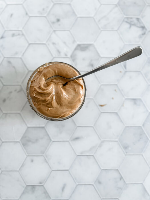 peanut butter in a jar with a spoon