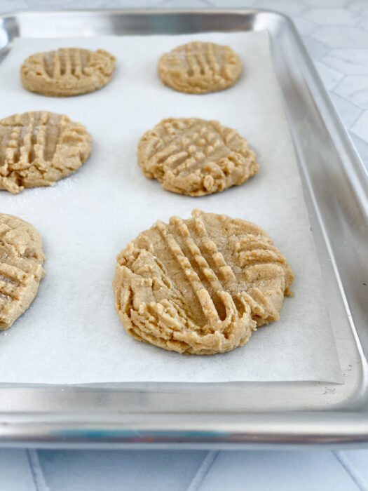 peanut butter cookies on tray out of oven