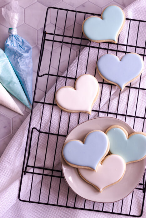 royal icing cookies on a drying rack