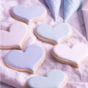 royal icing decorated cookies on a tea towel