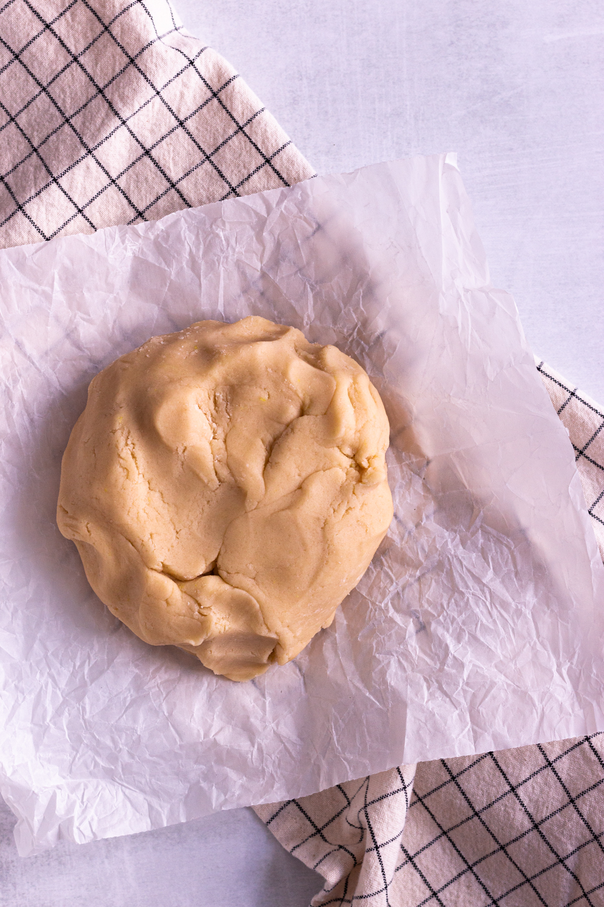 lemon cookie dough formed into a ball