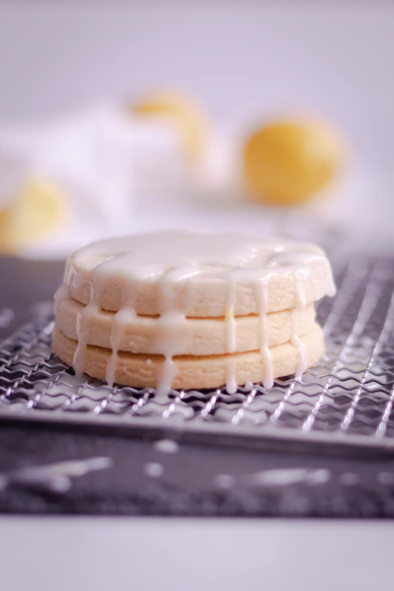 stack of sugar cookies glazed with lemon icing