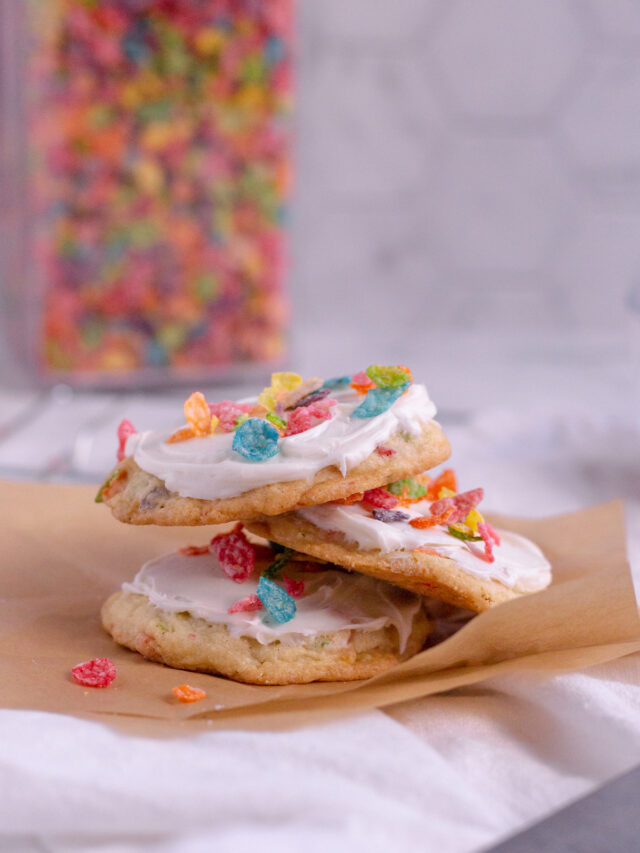 3 fruity pebble cookies stacked up