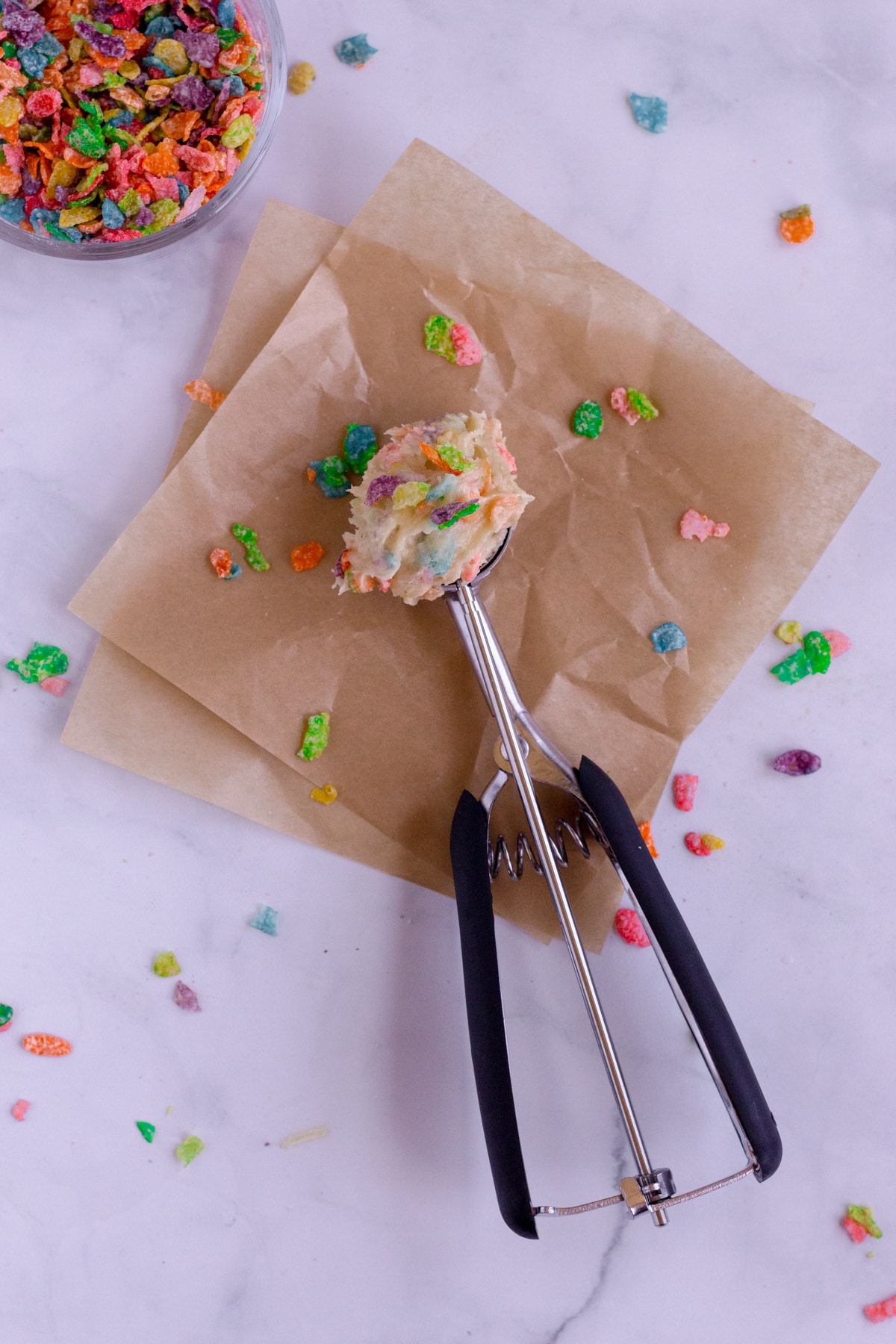 cookie scoop filled with fruity pebble cookie dough