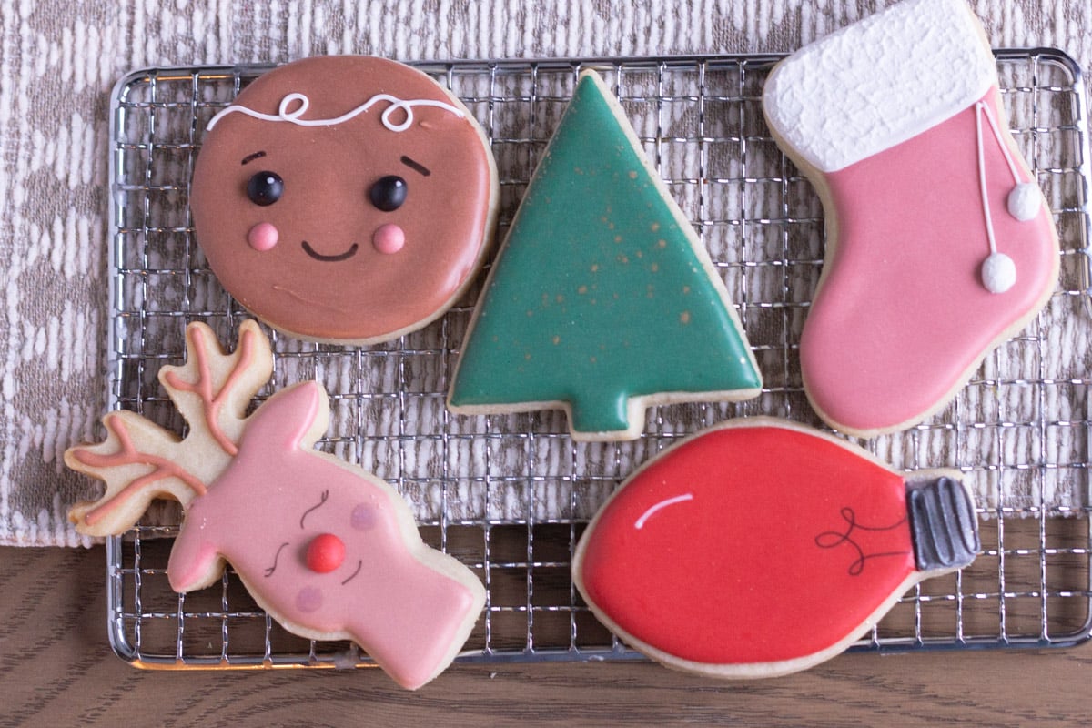 Decorated Christmas Cut out cookies on a cooling rack