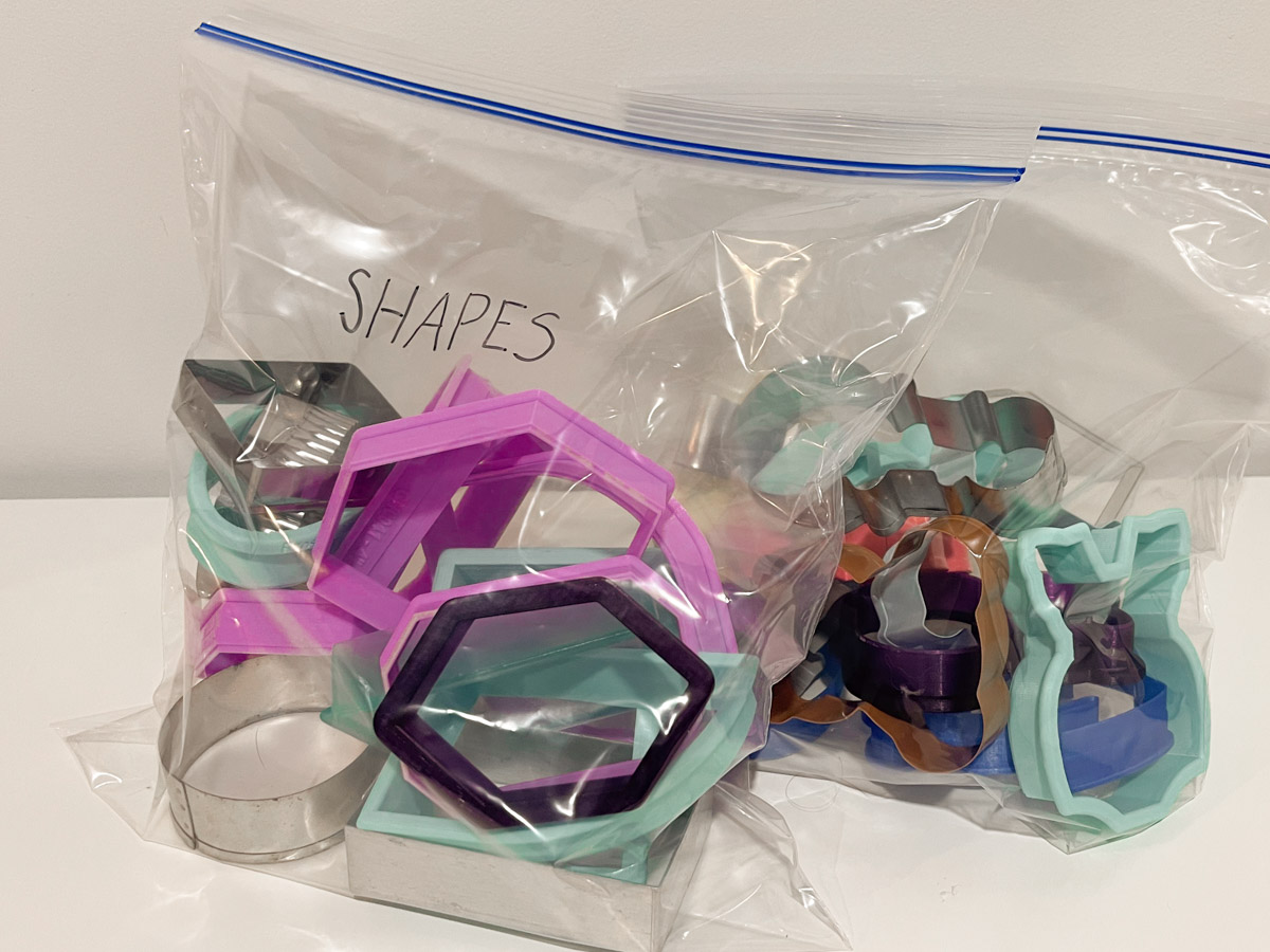 cookie cutters organized in Ziploc bags