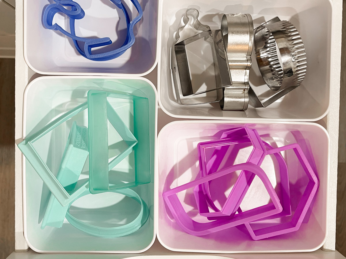 Cookie Cutters organized by color in a kitchen drawer