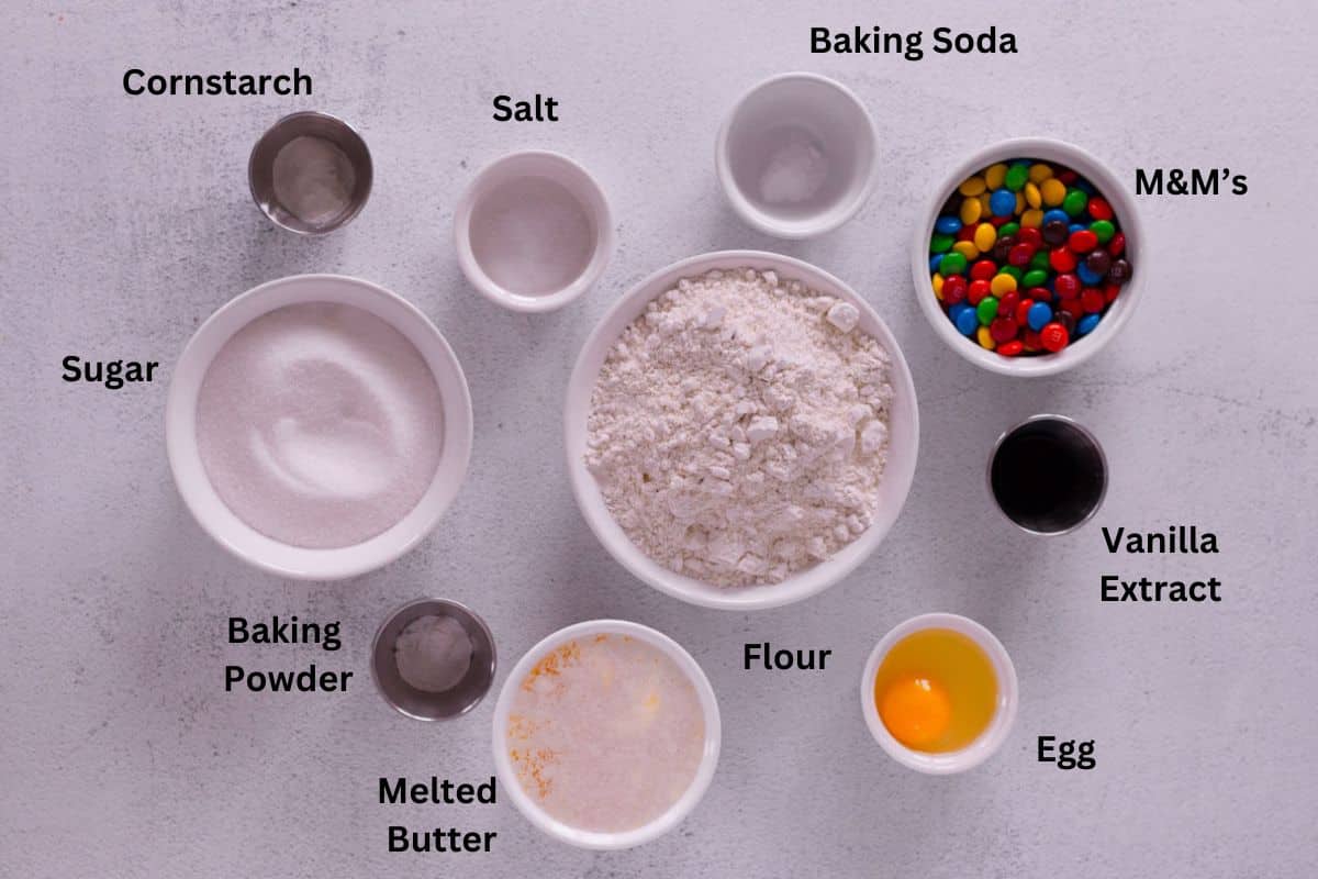 Ingredients for M&M Cookies in individual bowls. 