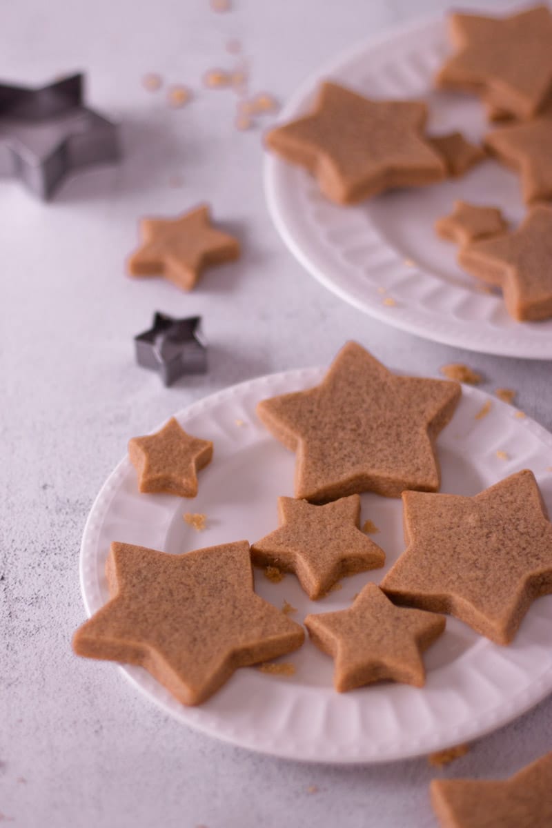 Star cut out cookies on a plate.
