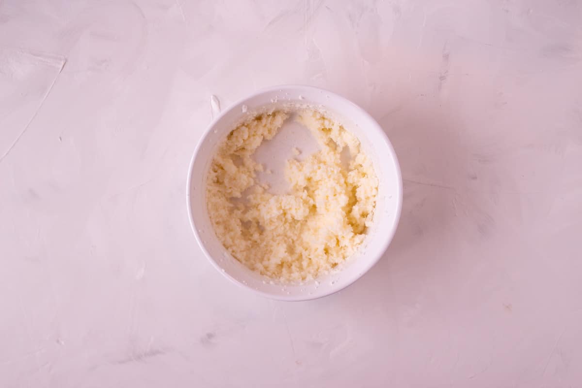 Butter, Shortening, and Sugar beat together in a bowl.