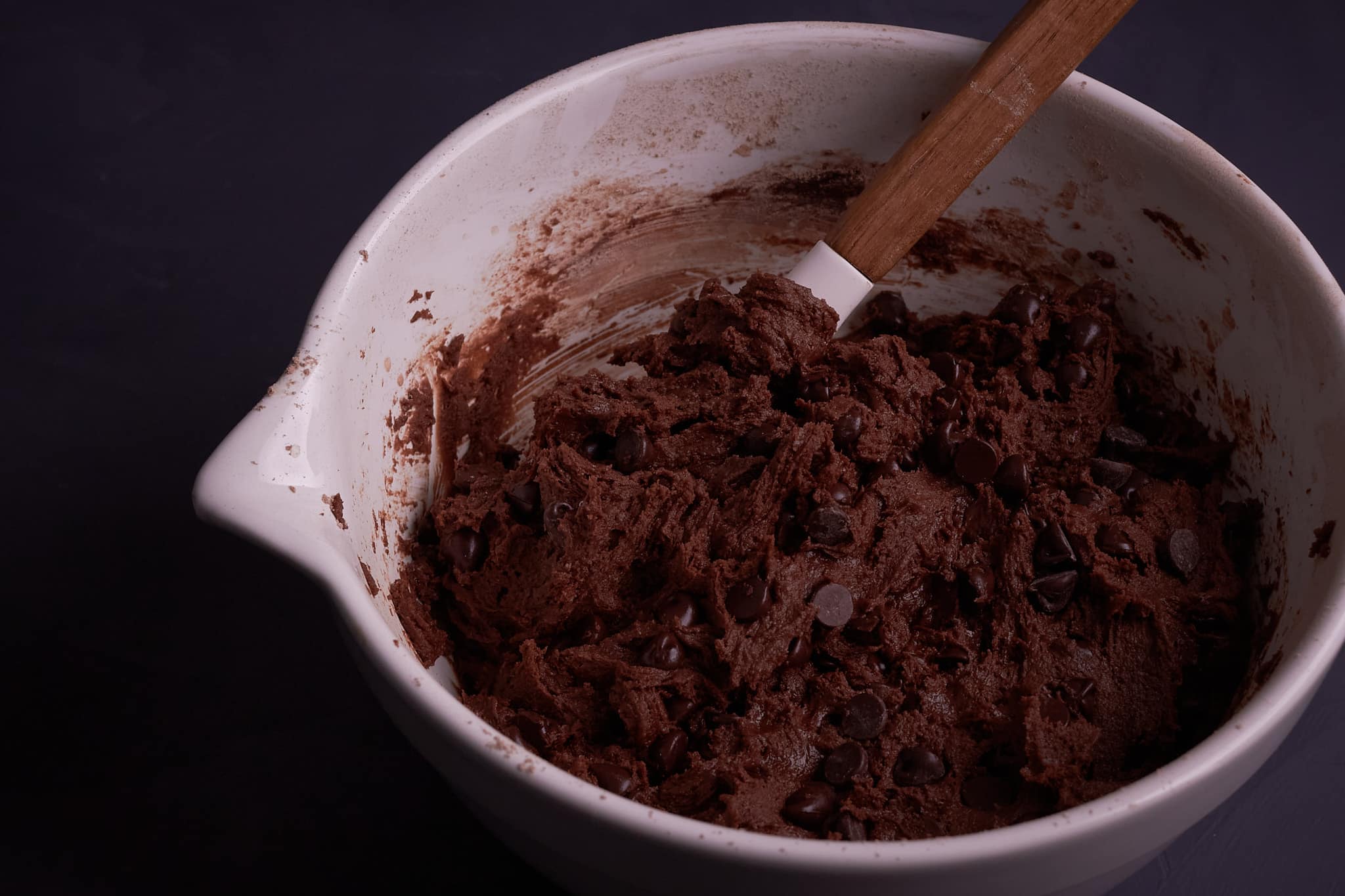 Cookie dough in bowl after adding dry ingredients and chocolate chips.