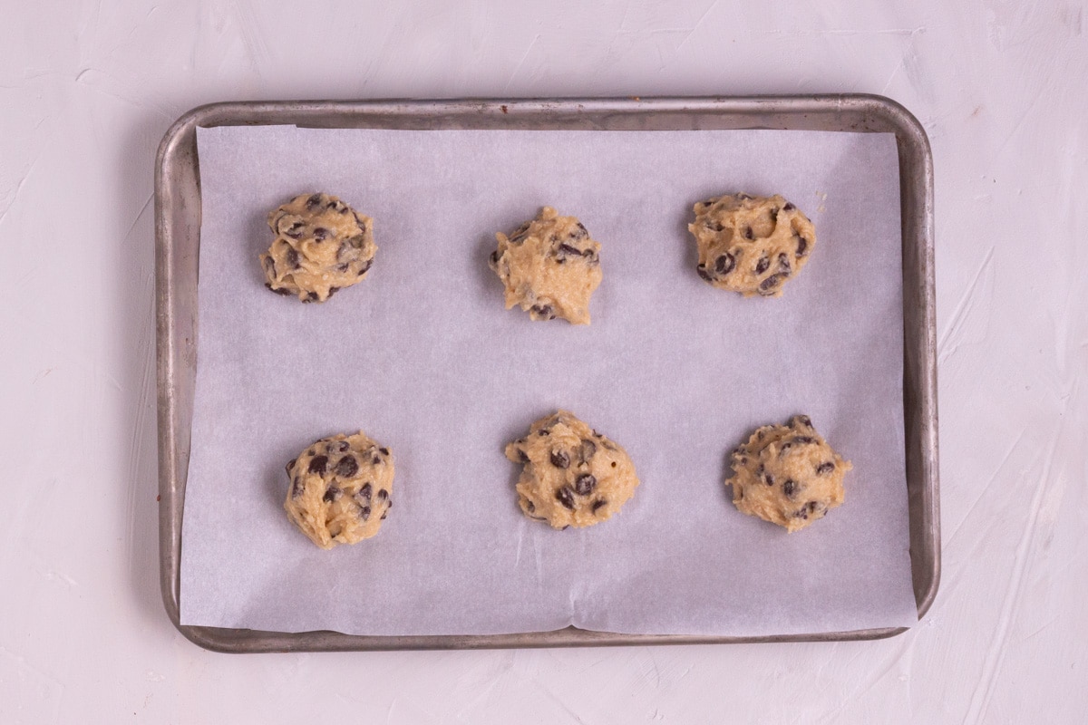 Cookie dough balls on a tray. 